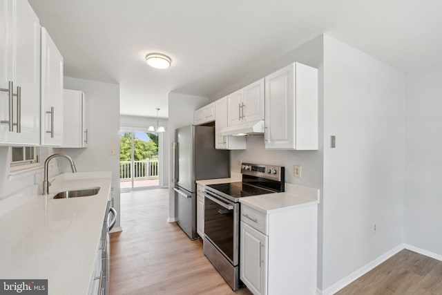 6 Flower Hill Ct, Gaithersburg, MD 20879 - kitchen featuring stainless steel appliances, under cabinet range hood, light wood-type flooring, white cabinetry, and light countertops