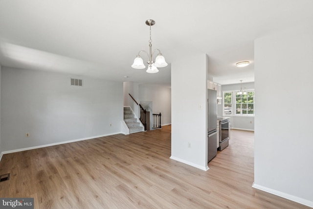 6 Flower Hill Ct, Gaithersburg, MD 20879 - empty room with a chandelier, stairway, and light wood-style floors