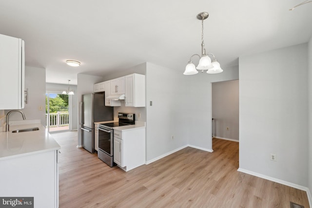 6 Flower Hill Ct, Gaithersburg, MD 20879 - kitchen with appliances with stainless steel finishes, a chandelier, light wood finished floors, and light countertops