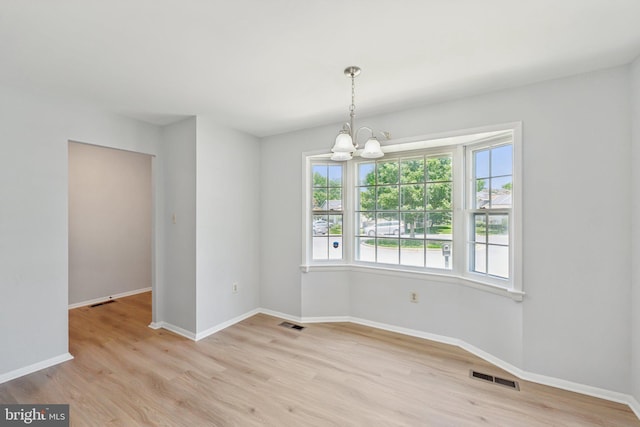 6 Flower Hill Ct, Gaithersburg, MD 20879 - unfurnished dining area featuring a chandelier and wood finished floors