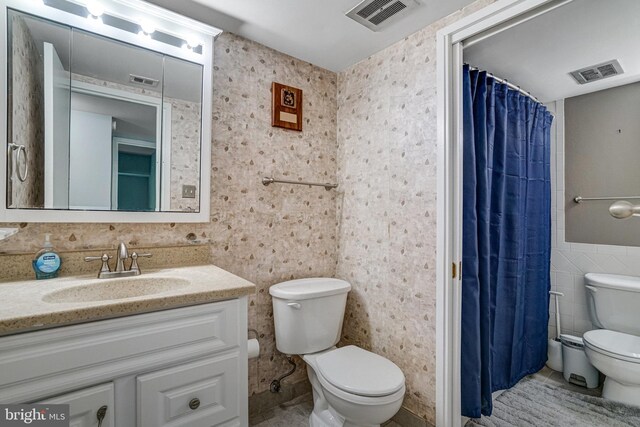 9730 Kingsbridge Dr Unit 002, Fairfax, VA 22031 - bathroom with tile walls, vanity, tile patterned flooring, and a shower with curtain