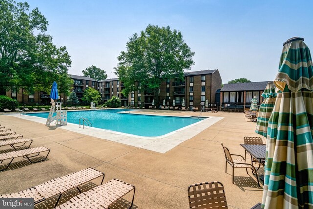 9730 Kingsbridge Dr Unit 002, Fairfax, VA 22031 - community pool featuring a patio