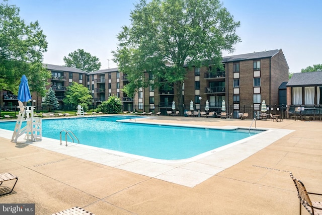 9730 Kingsbridge Dr Unit 002, Fairfax, VA 22031 - community pool with a patio area