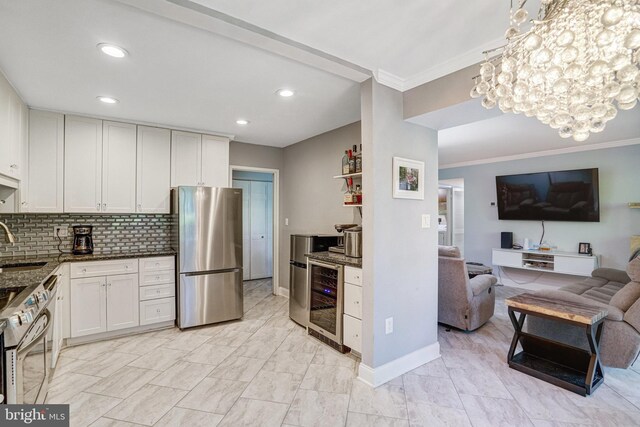 9730 Kingsbridge Dr Unit 002, Fairfax, VA 22031 - kitchen with stainless steel appliances, wine cooler, dark stone countertops, ornamental molding, and open floor plan