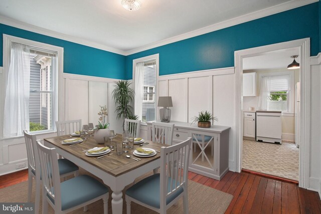 322 W End Ave, Cambridge, MD 21613 - dining area featuring a decorative wall, dark wood-type flooring, a wainscoted wall, and crown molding