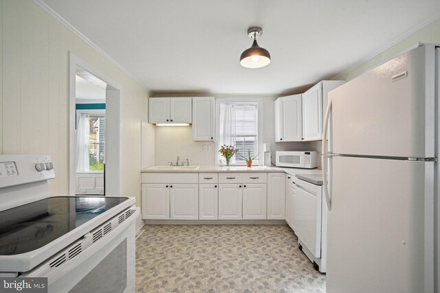 322 W End Ave, Cambridge, MD 21613 - kitchen featuring white appliances, white cabinets, ornamental molding, decorative backsplash, and light floors