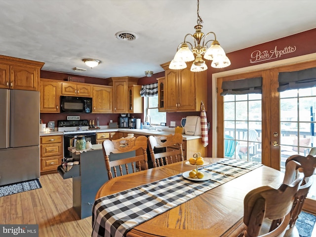 15606 Winslow St SW, Cresaptown, MD 21502 - dining space featuring healthy amount of natural light, a chandelier, and light wood-style floors
