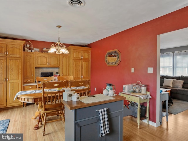15606 Winslow St SW, Cresaptown, MD 21502 - kitchen with a chandelier, light wood-type flooring, pendant lighting, and gray cabinetry
