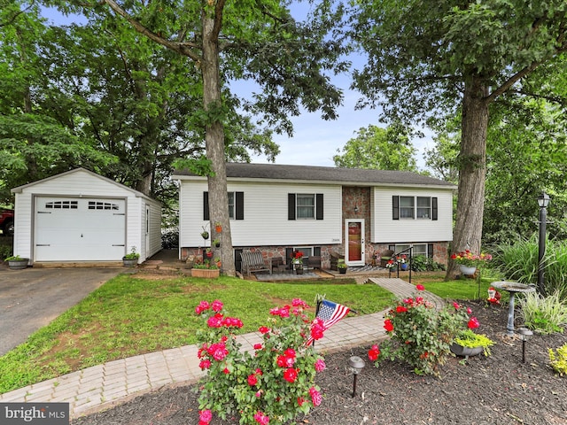 15606 Winslow St SW, Cresaptown, MD 21502 - split foyer home with an outbuilding, a detached garage, driveway, and a front lawn