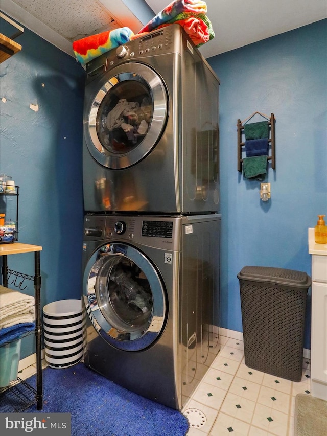 15606 Winslow St SW, Cresaptown, MD 21502 - laundry room with stacked washing machine and dryer and tile patterned floors
