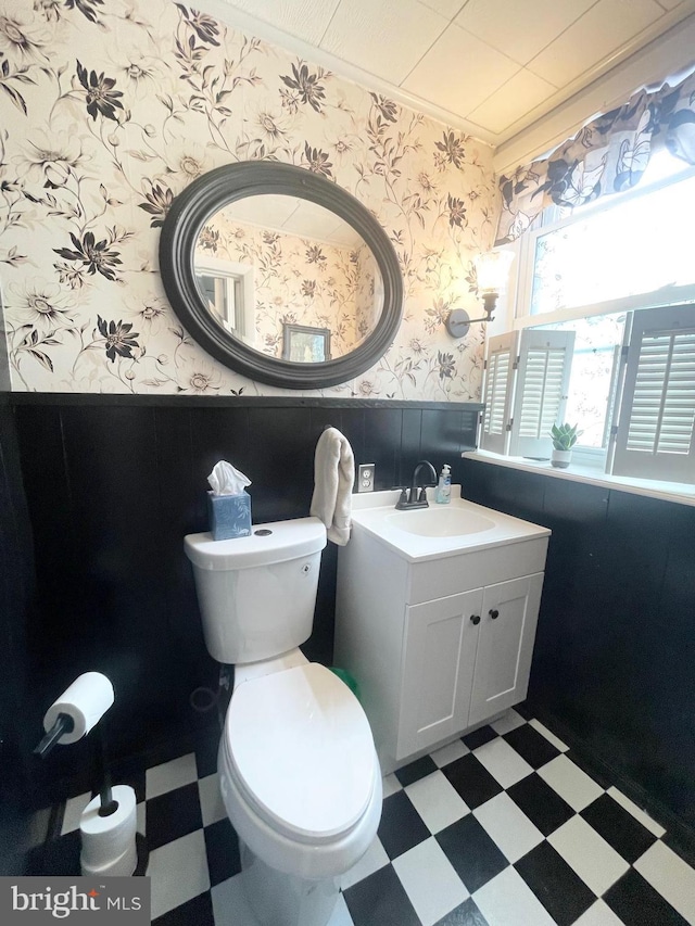 3427 Livingston St, Philadelphia, PA 19134 - half bath featuring wallpapered walls, tile patterned floors, a wainscoted wall, vanity, and crown molding