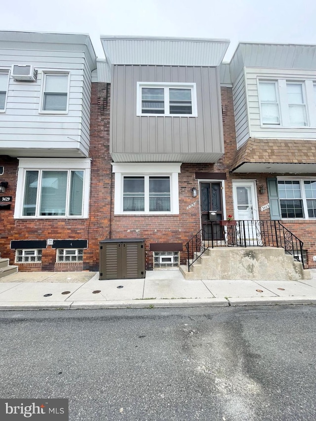 3427 Livingston St, Philadelphia, PA 19134 - view of property with brick siding and board and batten siding