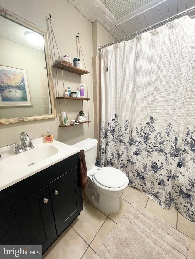 3427 Livingston St, Philadelphia, PA 19134 - full bath with tile patterned floors, vanity, and a shower with shower curtain
