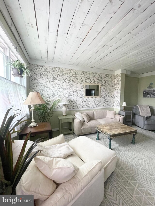 3427 Livingston St, Philadelphia, PA 19134 - living area with wallpapered walls and wooden ceiling