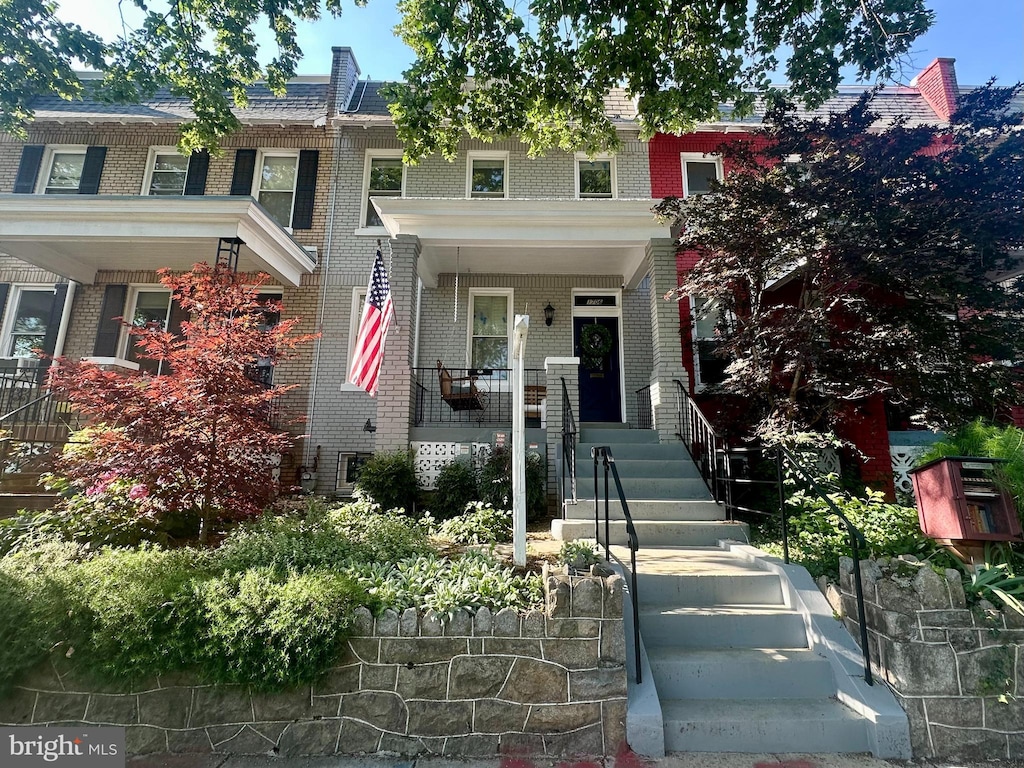 1706 E St SE, Washington, DC 20003 - view of front of property featuring brick siding and a porch