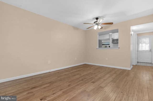 11920 Roan Ln, North Potomac, MD 20878 - spare room featuring light wood-style floors and a ceiling fan