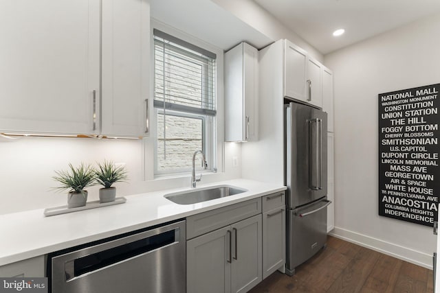 417 4th St SE Unit 2, Washington, DC 20003 - kitchen featuring appliances with stainless steel finishes, dark wood-style floors, light countertops, recessed lighting, and gray cabinetry