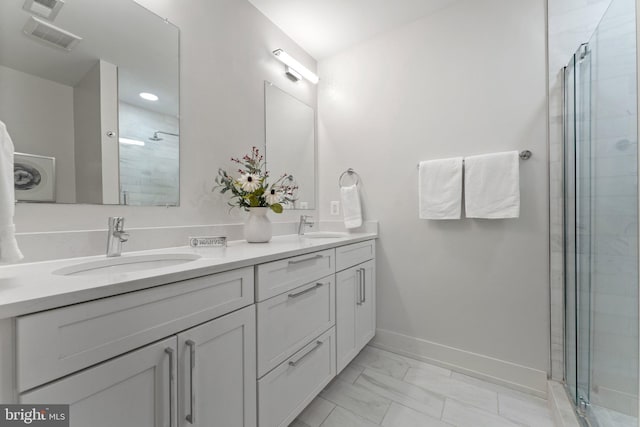 417 4th St SE Unit 2, Washington, DC 20003 - full bathroom featuring marble look tiles, double vanity, and a shower stall