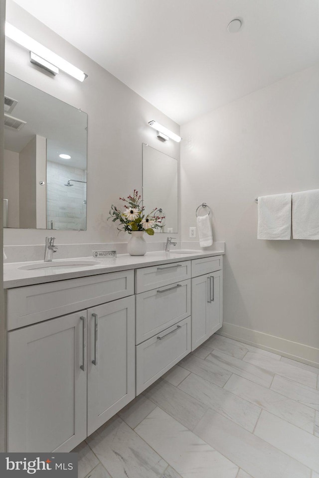 417 4th St SE Unit 2, Washington, DC 20003 - full bath featuring marble finish floors, double vanity, and a tile shower