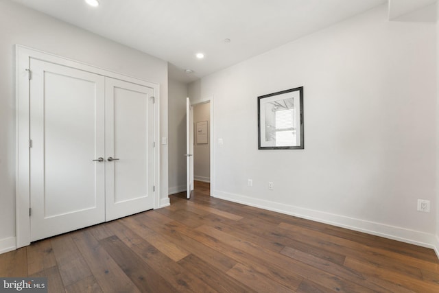 417 4th St SE Unit 2, Washington, DC 20003 - unfurnished bedroom with dark wood finished floors, recessed lighting, and a closet