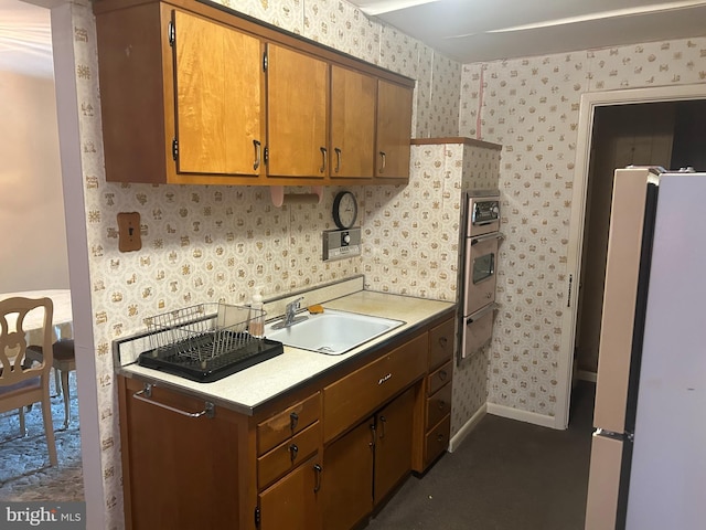 3532 Primrose Rd, Philadelphia, PA 19114 - kitchen featuring freestanding refrigerator, wallpapered walls, light countertops, and brown cabinets