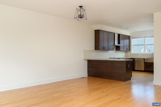 407 Fennel Rd, Crozet, VA 22932 - kitchen with dishwasher, light wood finished floors, dark brown cabinets, backsplash, and hanging light fixtures