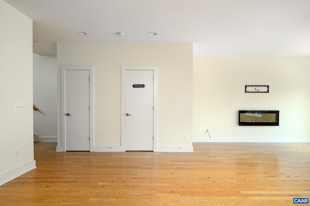 407 Fennel Rd, Crozet, VA 22932 - unfurnished living room with light wood-style floors and recessed lighting