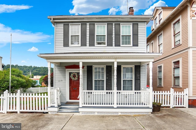 123 N 2nd St, Newport, PA 17074 - view of front of home with a porch and a chimney