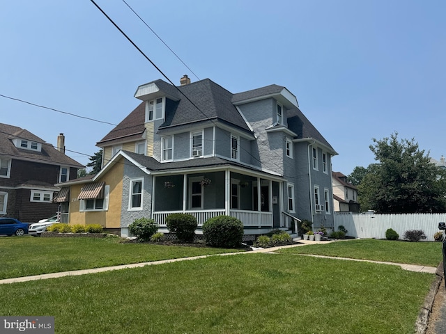 211 Penn St, Ridley Park, PA 19078 - victorian house with covered porch, a chimney, and a shingled roof