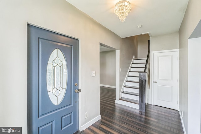 211 Penn St, Ridley Park, PA 19078 - foyer featuring stairs, dark wood-style flooring, and a chandelier