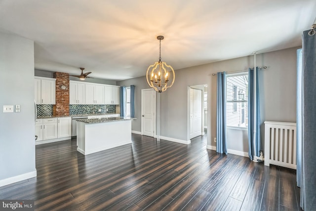 211 Penn St, Ridley Park, PA 19078 - kitchen featuring a chandelier, dishwasher, white cabinets, a center island, and dark wood-style flooring