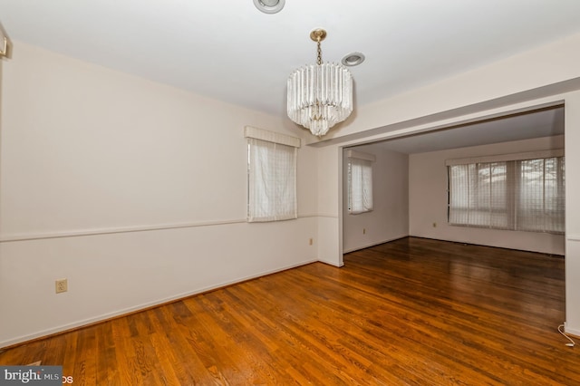7617 Seven Mile Ln, Baltimore, MD 21208 - unfurnished room featuring a chandelier and wood finished floors