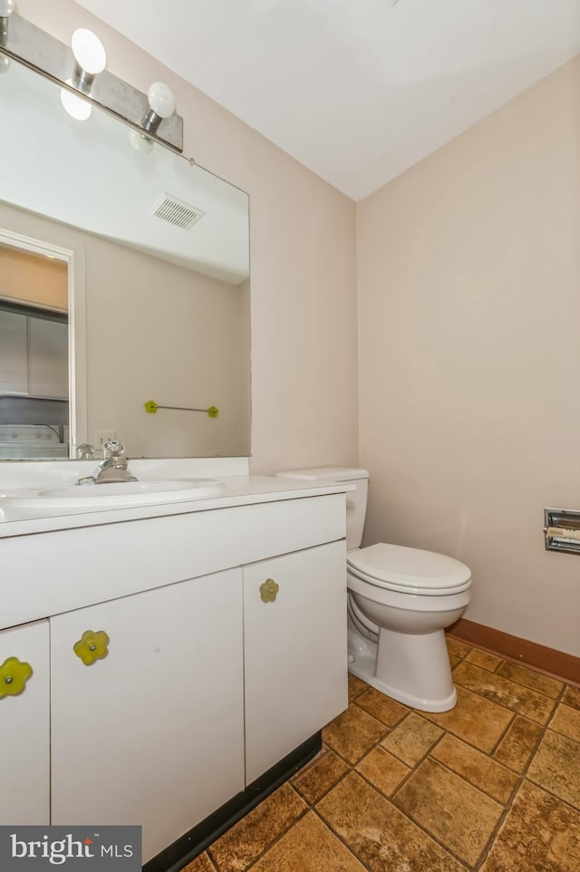 7617 Seven Mile Ln, Baltimore, MD 21208 - bathroom featuring vanity and stone tile floors