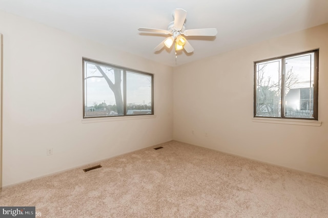 7617 Seven Mile Ln, Baltimore, MD 21208 - carpeted empty room featuring plenty of natural light and ceiling fan