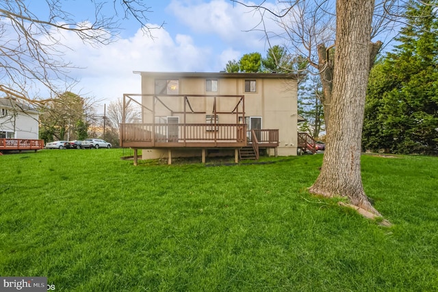 7617 Seven Mile Ln, Baltimore, MD 21208 - back of house featuring a wooden deck and a lawn