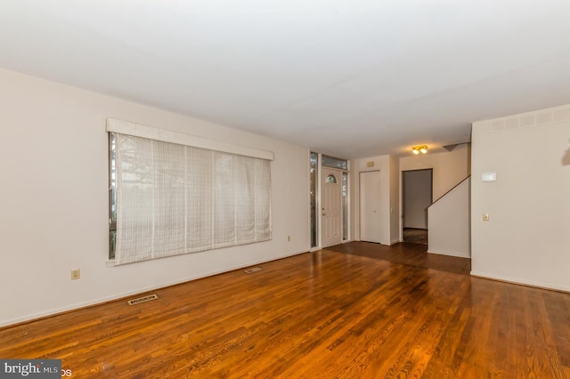 7617 Seven Mile Ln, Baltimore, MD 21208 - unfurnished room featuring wood finished floors and stairs