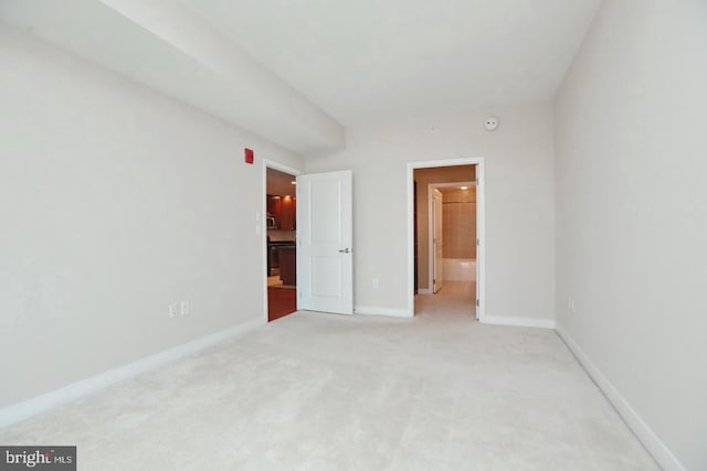 155 Potomac Psge Unit 527, Oxon Hill, MD 20745 - unfurnished bedroom with light carpet and connected bathroom