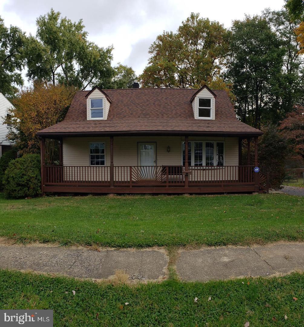 16 Tollgate Rd, Owings Mills, MD 21117 - view of front of house with a front lawn, covered porch, and a shingled roof