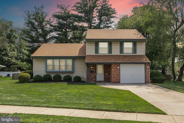 177 Antietam Rd, Delran, NJ 08075 - tri-level home with an attached garage, concrete driveway, a shingled roof, and brick siding