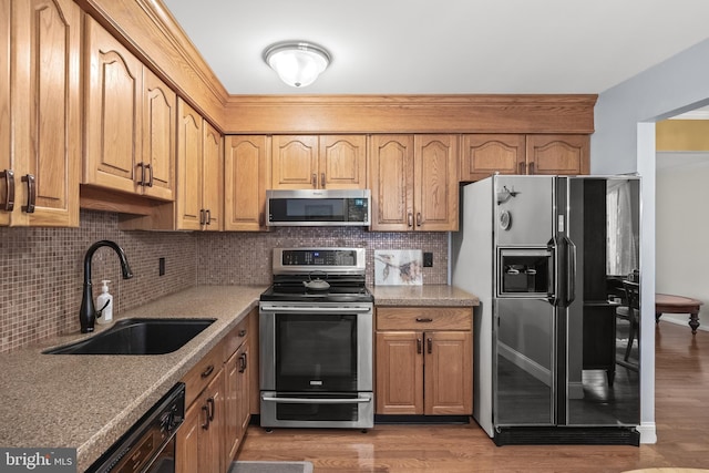 177 Antietam Rd, Delran, NJ 08075 - kitchen featuring stainless steel appliances, decorative backsplash, light wood-style flooring, and light countertops