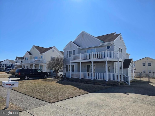 3 Lighthouse Cv, Brigantine, NJ 08203 - townhome / multi-family property featuring a balcony, covered porch, and a residential view