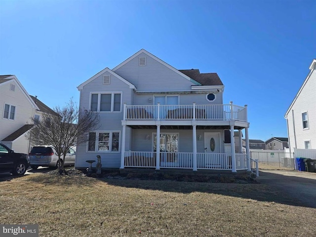 3 Lighthouse Cv, Brigantine, NJ 08203 - view of front facade with a balcony and covered porch