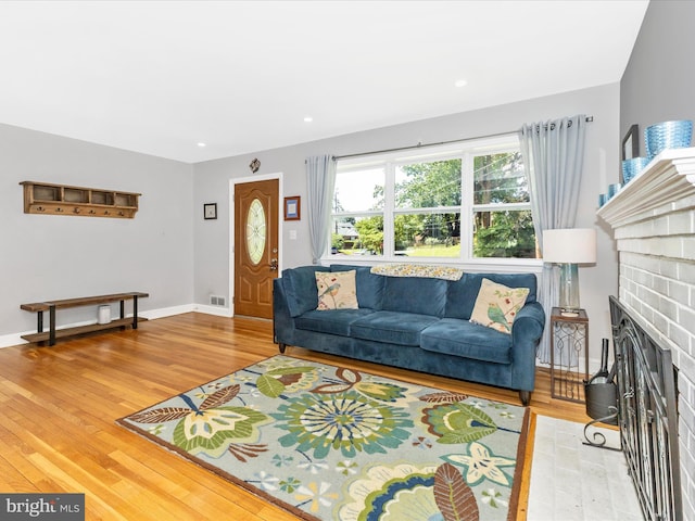 507 Kerwin Ct, Silver Spring, MD 20901 - living area featuring wood finished floors and a fireplace