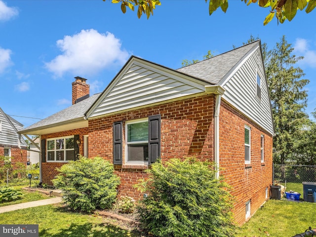 507 Kerwin Ct, Silver Spring, MD 20901 - view of home's exterior featuring brick siding, a chimney, and a shingled roof