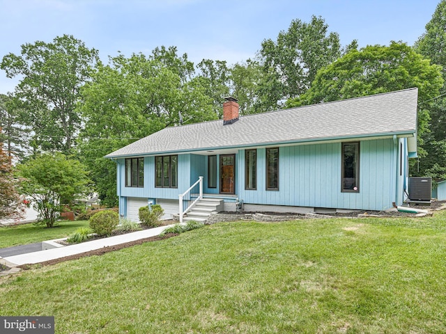 261 W Chestnut Hill Rd, Newark, DE 19713 - view of front facade with a chimney, a front yard, a shingled roof, and a porch