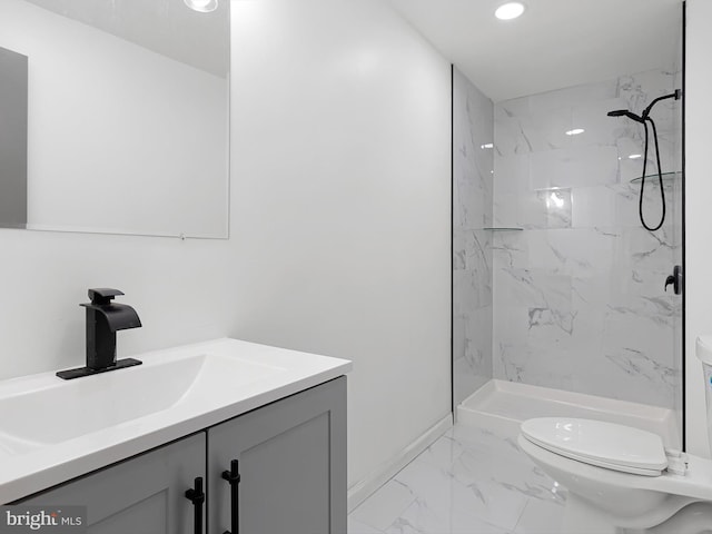 261 W Chestnut Hill Rd, Newark, DE 19713 - bathroom featuring marble look tiles, vanity, a marble finish shower, and recessed lighting