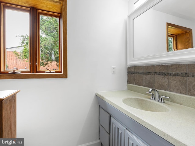 261 W Chestnut Hill Rd, Newark, DE 19713 - bathroom with vanity and decorative backsplash