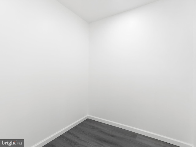 261 W Chestnut Hill Rd, Newark, DE 19713 - spare room featuring baseboards and dark wood-style floors