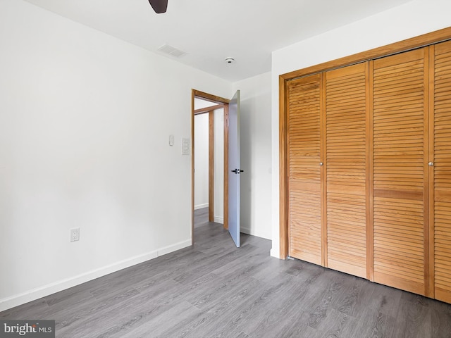 261 W Chestnut Hill Rd, Newark, DE 19713 - unfurnished bedroom with a closet, wood finished floors, and a ceiling fan