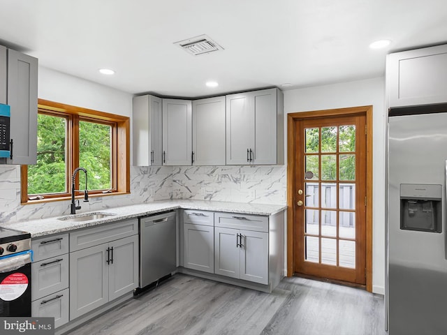 261 W Chestnut Hill Rd, Newark, DE 19713 - kitchen featuring appliances with stainless steel finishes, gray cabinets, healthy amount of natural light, and recessed lighting